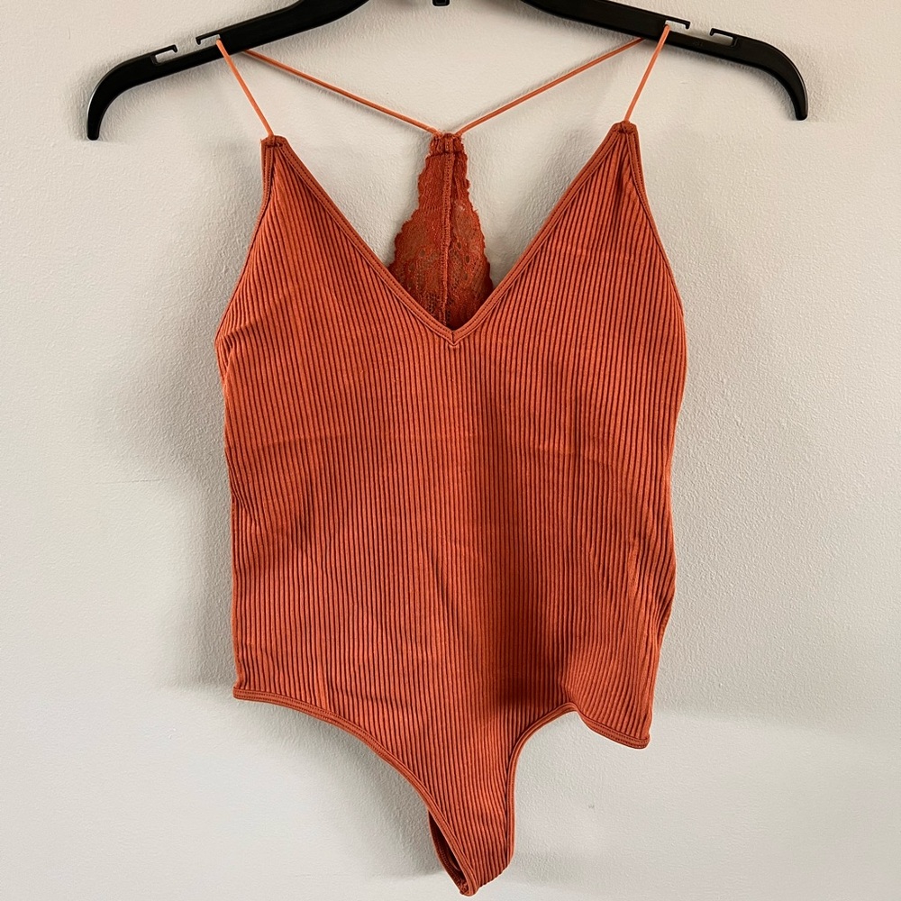 Dynamic seamless bodysuit! One size. So comfortable! Lace detail on the back.